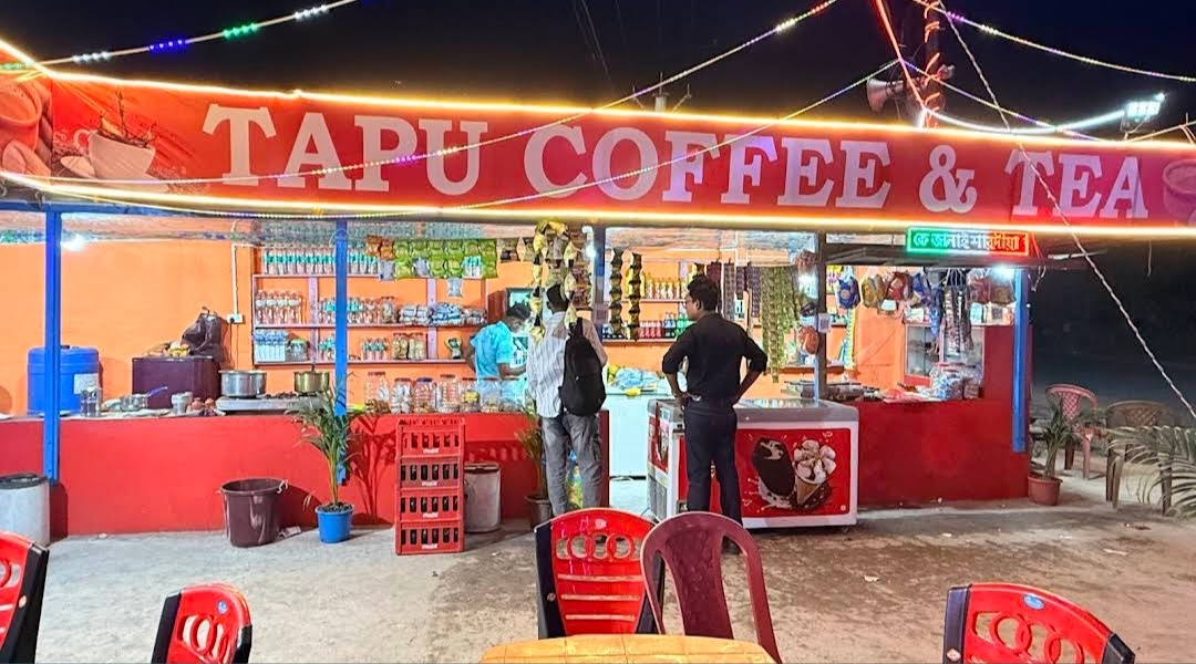 Tapu Coffee & Tea neon lit at night